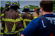 Firefighters facing away training in a group