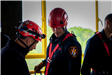 Firefighter and Instructor reviewing drills