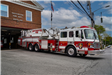 Fire truck parked outside of fire station