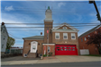 Fire Station with red garage door and a side white door